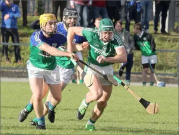  ??  ?? Cloughbawn’s Harry Kehoe in action against Glynn-Barntown’s Alan Cowman.