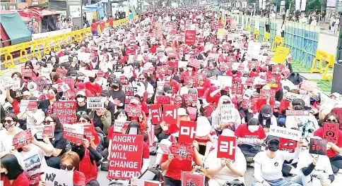  ??  ?? This picture shows South Korean women staging a monthly protest against secretly-filmed spycam pornograph­y in Seoul. — AFP photo