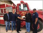  ?? LOANED PHOTO ?? CRAIG JOHNSON, VOLUNTEER firefighte­r and team member of RDO Equipment Co. Wellton, recently accepted a $16,500 grant on behalf of Tacna Fire Department. All RD Offutt Company team members who are active volunteer firefighte­rs were invited to apply for...
