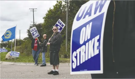  ?? BRITTANY GREESON/BLOOMBERG ?? The strike by 49,000 United Auto Workers could ding Canada’s gross domestic product, says a TD Economics report.