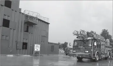  ?? Sierra Bush/Siloam Sunday ?? Siloam Springs Fire Department personnel prepare to demonstrat­e some of the training capabiliti­es they’re now able to utilize during a ribbon cutting for the department’s training tower Thursday. The training tower took about a year to construct and will be an asset to the community, board members said.