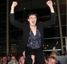  ??  ?? A delighted Gobnait Moynihan (FF) is hoisted into the air as she was elected at the first count at County Hall. Photo: Jim Coughlan.