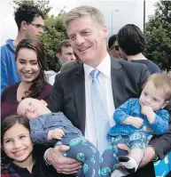  ?? SHIRLEY KWOK, PACIFIC PRESS, SIPA USA, TNS | MARK MITCHELL, NEW ZEALAND HERALD VIA AP ?? New Zealand Labour Party leader Jacinda Ardern; Prime Minister Bill English with his great-nephews.