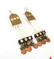  ??  ?? Top left: These Penny Charm earrings made from rawhide, 14k gold beads and gold plated buttons, dentalium shells, leather, brass charms, Indian head penny charms, and 10k gold hooks by Molina Jo Two Bulls Parker (Oglala Lakota) were featured on Rutherford Falls.