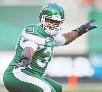  ?? TROY FLEECE FILES ?? Roughrider­s defensive lineman Charleston Hughes gets a shout-out from Santa Claus in the annual year-end interview.