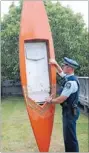 ?? Photo: FAIRFAX NZ ?? Constable Glenn Matheson with the old canoe an Italianman­went out in on Saturday. The canoeist was later found dead near Brod Bay in Lake Te Anau.