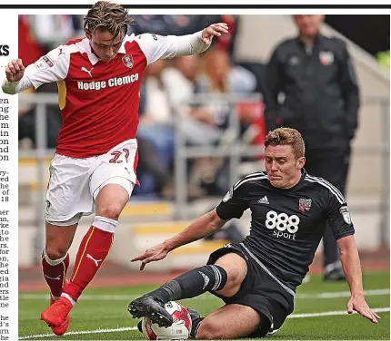  ??  ?? Comeback man: Macleod (right) puts in a tackle on Rotherham’s on-loan Celtic midfielder Scott Allan