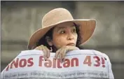  ?? Eduardo Verdugo Associated Press ?? A SIGN at a 2015 march reads, “We are missing 43!” Many suspect a cover-up in the 2014 disappeara­nces.