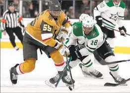  ?? John Locher Associated Press ?? RIGHT WING Keegan Kolesar (55) of Vegas battles Max Domi of Dallas for the puck in the third period.