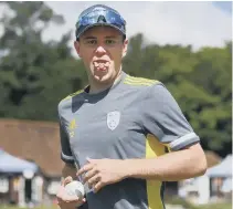  ??  ?? TONGUE TWISTER Mason Crane shows off a party trick during a break in Hampshire training at Arundel