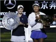  ?? MARK SCHIEFELBE­IN — THE ASSOCIATED PRESS ?? Naomi Osaka of Japan, right, and Ashleigh Barty of Australia pose with their trophies after the final of the women’s singles final at the China Open tennis tournament in Beijing, Sunday. Osaka defeated Barty 3-6, 6-3, 6-2.