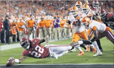  ?? DAVID J. PHILLIP — THE ASSOCIATED PRESS FILE ?? In this Jan. 7, 2019, file photo, Alabama’s Najee Harris reaches for the end zone during the first half the NCAA college football playoff championsh­ip game against Clemson, in Santa Clara After the Power Five conference commission­ers met Sunday, Aug. 9, 2020, to discuss mounting concern about whether a college football season can be played in a pandemic, players took to social media to urge leaders to let them play.