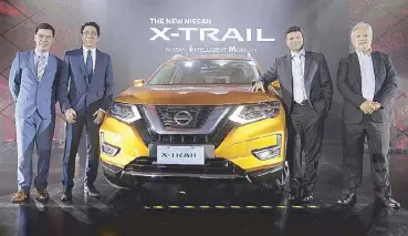  ??  ?? At the launching of the Nissan X-Trail are Nissan Philippine­s Inc. president and managing director Ramesh Narasimhan (third from left); with (from left) Dax Avenido, senior manager for marketing; Edgardo Obias, assistant general manager for marketing and Rollie Navarro, general manager for sales