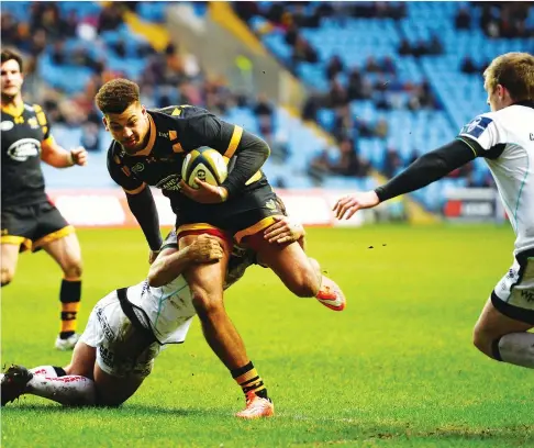  ?? PICTURE: Getty Images ?? Natural break: Wasps’ Guy Armitage is tackled by Ospreys’ Joe Thomas as he runs in to score in last season’s Anglo Welsh Cup