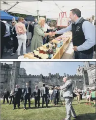  ??  ?? STOCKING UP: From top, the Duchess of Cornwall looks a food stalls during her visit to Kilkenny Castle, where the Prince of Wales also tried his hand at hurling.