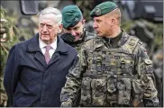  ?? MINDAUGAS KULBIS / ASSOCIATED PRESS ?? U.S. Secretary of Defense James Mattis (left) speaks with Lt. Col. Christoph Huber (right), commander of a German battalion that recently arrived in Pabrade, Lithuania, on Wednesday.