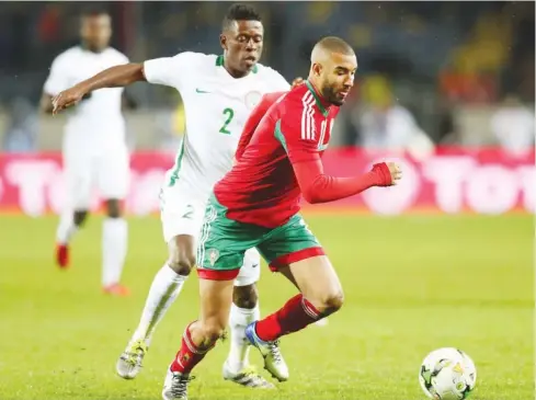  ??  ?? Super Eagles defender Osas Okoro (2) vies for the ball with a Moroccan player during the final match of the CHAN 2018 in Casablanca last Sunday. Morocco won 4-0