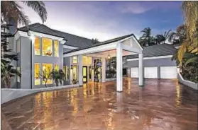  ??  ?? WITH A gated driveway and porte-cochère, the home, now tenant-occupied until 2023, is listed for $7.995 million.