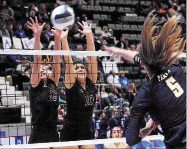  ?? STAN HUDY - SHUDY@DIGITALFIR­STMEDIA.COM ?? Burnt Hills-Ballston Lake senior Avery Pollard (13) and Myla Dobson (10) go up to block a slam from Walter Panas Yvette Burcescu in the first set of Saturday’s New York State Class A Final Four at Cool Insuring Arena in Glens Falls.