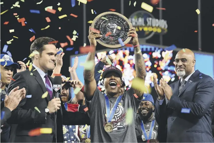  ?? JAYNE KAMIN-ONCEA/GETTY IMAGES ?? Marcus Stroman shows off his MVP award after firing six innings of one-hit baseball against Puerto Rico in Wednesday’s final at the World Baseball Classic.