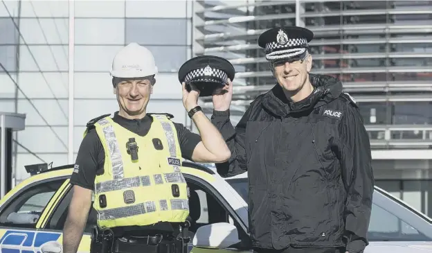  ??  ?? 0 In 2016 Police Scotland’s Chief Constable Phil Gormley, right, launched a drive to recruit more special constables from within the ranks of BT