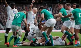  ??  ?? England celebrate after Luke Cowan-Dickie touches down for England’s third try against Ireland. Photograph: Tom Jenkins/The Guardian