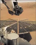  ?? NASA ?? A view from the arm-mounted camera on the Insight Mars lander is seen Friday. The spacecraft arrived on the planet on Nov. 26.