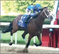  ?? The Sentinel-Record/Richard Rasmussen ?? HIGH STANDARDS: Jockey Gabriel Saez and By My Standards cross the wire in front to win the Oaklawn Handicap Saturday at Oaklawn Racing Casino Resort.