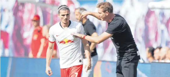  ?? FOTO: ELMAR KREMSER/SVEN SIMON/IMAGO IMAGES ?? Machten sich beide jüngst auf den Weg von Leipzig aus nach München: Julian Nagelsmann (re.) und Ex-RB-Kapitän Marcel Sabitzer.