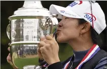  ?? ERIC GAY — THE ASSOCIATED PRESS ?? A Lim Kim, of South Korea, kisses the championsh­ip trophy after winning the U.S. Women’s Open on Monday in Houston.