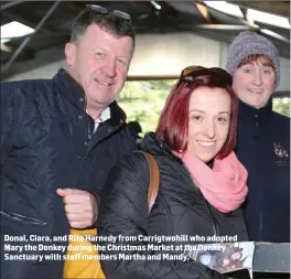  ??  ?? Donal, Ciara, and Rita Harnedy from Carrigtwoh­ill who adopted Mary the Donkey during the Christmas Market at the Donkey Sanctuary with staff members Martha and Mandy.