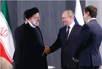  ?? (Iranian Presidenti­al Website/WANA/handout via Reuters) ?? RUSSIAN PRESIDENT Vladimir Putin meets with Iranian President Ebrahim Raisi at a summit in Samarkand, Uzbekistan, last month.