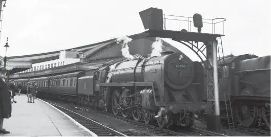  ?? Transport Treasury ?? In one of the platforms built in the 1930s to the east of the Wyatt trainshed at Bristol (Temple Meads), bringing the total platforms up to 15, on 30 July 1954 we find BR Standard ‘Britannia’ Pacific No 70024 Vulcan on an up passenger service. New to Laira shed in February 1952 and remaining a Plymouth-based engine until transfer to Cardiff (Canton) in December 1956. As it was intended to be a Western Region member of the class it carries the name of one of the earliest broad gauge locomotive­s of the GWR – Vulcan was a 2-2-2 built by Charles Tayleur & Co, Vulcan Foundry, Newton-le-Willows (maker’s No 51); it was delivered to the GWR on 25 November 1837 and would finally cease work in April 1868, albeit converted to become a tank engine after 1846. In due course, the ‘Britannia’ fleet on the Western Region found new haunts, Vulcan reaching Aston, in Birmingham, on 10 September 1961, and so the broad gauge naming connection gradually faded from widespread knowledge.