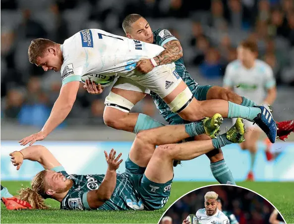  ?? GETTY IMAGES ?? Loose forward Dalton Papalii is taken to ground by Highlander­s halfback Aaron Smith on this occasion but his two tries were crucial in the Blues’ win. Right, Rieko Ioane streaks upfield for the Blues.
