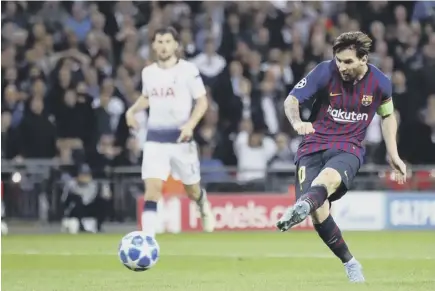  ??  ?? 2 Lionel Messi scores his second and Barcelona’s fourth goal against Tottenham as the Catalans showed their class on a patchy Wembley surface last night.