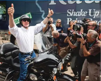  ??  ?? Then Republican gubernator­ial candidate Bruce Rauner arrives at the Illinois State Fair during Republican Day, August 13, 2014, in Springfiel­d.
| SUN- TIMES FILE PHOTO