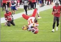  ?? Doug Murray / Associated Press ?? Chiefs wide receiver Tyreek Hill (10) does a back flip into the end zone to score a touchdown against the Buccaneers in November.