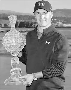  ??  ?? Jordan Spieth poses with the trophy after winning the AT&T Pebble Beach Pro-Am at Pebble Beach Golf Links in Pebble Beach, California. — AFP photo