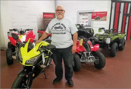  ?? PHOTOS BY DONNA ROVINS — DIGITAL FIRST MEDIA ?? Randy Kiss, owner of Kiss Cycles in Pottstown, is shown with some of the inventory in his shop. Kiss has announced the store will close Dec. 23 after 103 years.