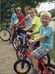  ?? JIM GOREY VIA AP ?? This July 2017 photo provided by the family shows Kevin Neubert and Jim Gorey’s adopted children, Lucas, Zach, Natalie, Jacob, and Derek in Lisle, Ill. “Some people thought we were crazy, but everyone was supportive of keeping the kids together,”...