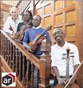  ?? PICTURE: SBONELO NGCOBO/AFRICAN NEWS AGENCY (ANA) ?? FOCUS: Dutch conductor and artistic director Arjan Tien with music students, Zamanje Luthuli, Sibonelo Mkhize and Wonderboy Mhlongo at the Durban Music School this week.