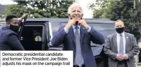  ??  ?? Democratic presidenti­al candidate and former Vice President Joe Biden adjusts his mask on the campaign trail