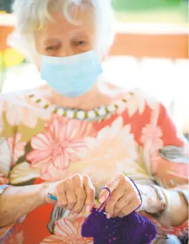  ?? RICK KINTZEL/THE MORNING CALL ?? Althea Beil, 99, crochets a towel at Cedarbrook nursing home in Fountain Hill. She lost her eyesight several years ago.