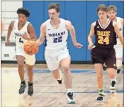  ?? Jeremy Stewart, file ?? Armuchee’s Wyatt Miller brings the ball over midcourt after a turnover against Dade County last season.