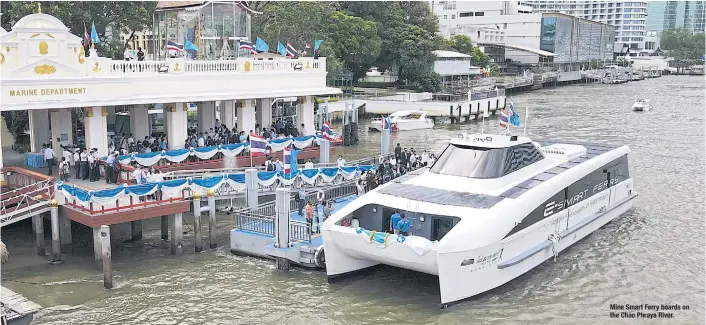  ??  ?? Mine Smart Ferry boards on the Chao Phraya River.