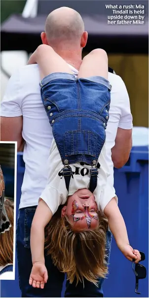  ??  ?? What a rush: Mia Tindall is held upside down by her father Mike