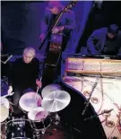  ?? Pierre Verdy/AFP/Getty Images/File ?? Drummer Charlie Watts, bassist Dave Green and pianist Ben Waters perform at Le Duc des Lombards.