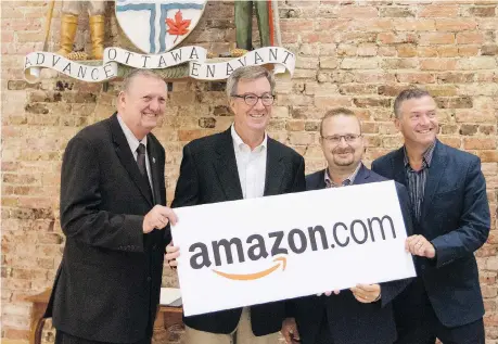  ?? ERROL MCGIHON ?? Orléans Coun. Bob Monette, Mayor Jim Watson, Cumberland Coun. Stephen Blais, and Beacon Hill-Cyrville Coun. Tim Tierney pose for photos after the announceme­nt Amazon would build a large fulfilment centre in the east end of the city.