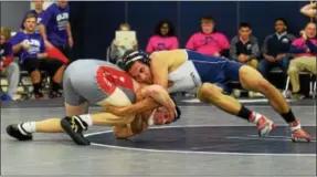  ?? AUSTIN HERTZOG - DIGITAL FIRST MEDIA ?? Pottstown’s Demond Thompson, right, and Owen J. Roberts’ Tyler McCutchen duel at 132 pounds Wednesday. McCutchen won 9-2.