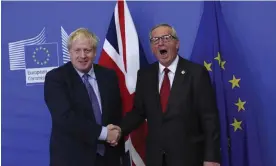  ?? Photograph: Francisco Seco/AP ?? Boris Johnson shakes hands with the then EU president Jean-Claude Juncker in 2019.